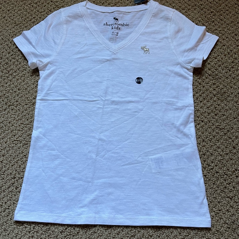 Abercrombie kids never been worn, with tags, brand new white tee shirt!
